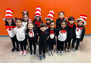 Group of happy student in Dr. Seuss costumes